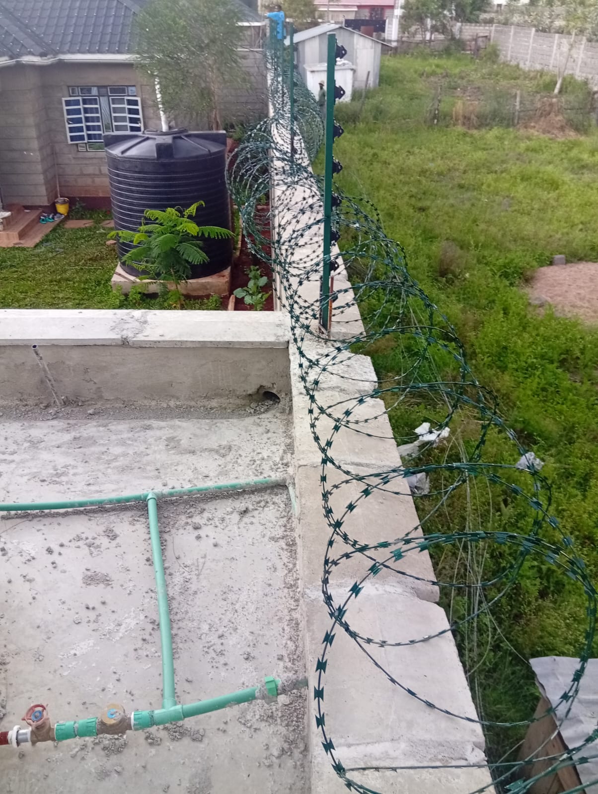 Electric fence perimeter installation around a compound